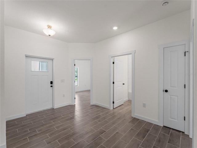 14449 Appleton Blvd, Port Charlotte, FL 33981 - foyer entrance with dark wood-style flooring and recessed lighting