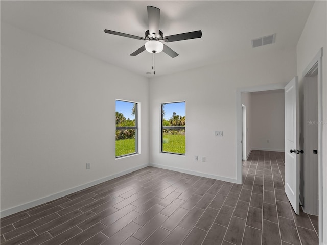 14449 Appleton Blvd, Port Charlotte, FL 33981 - unfurnished room featuring a ceiling fan and dark wood-style floors