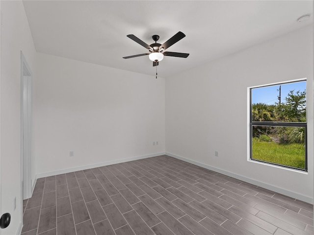 14449 Appleton Blvd, Port Charlotte, FL 33981 - spare room featuring a ceiling fan, dark wood-type flooring, and a smoke detector