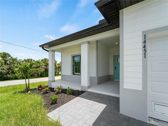 14449 Appleton Blvd, Port Charlotte, FL 33981 - view of exterior entry featuring a porch
