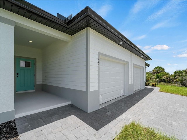 14449 Appleton Blvd, Port Charlotte, FL 33981 - garage featuring decorative driveway