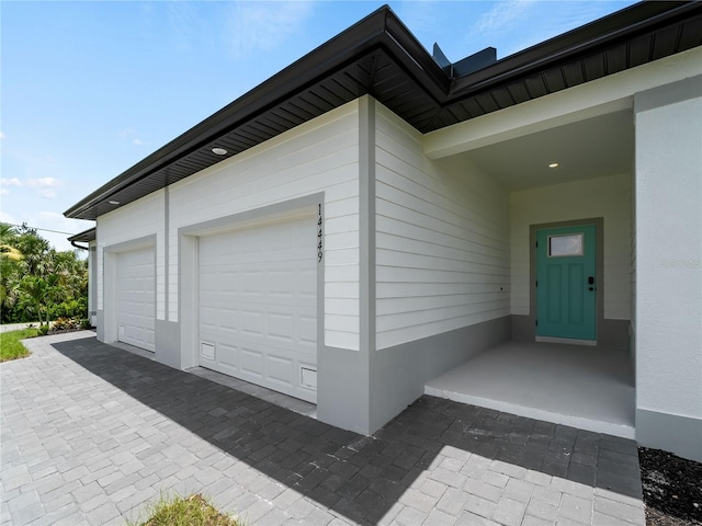 14449 Appleton Blvd, Port Charlotte, FL 33981 - garage with decorative driveway