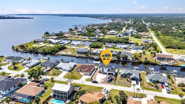 birds eye view of property featuring a residential view and a water view