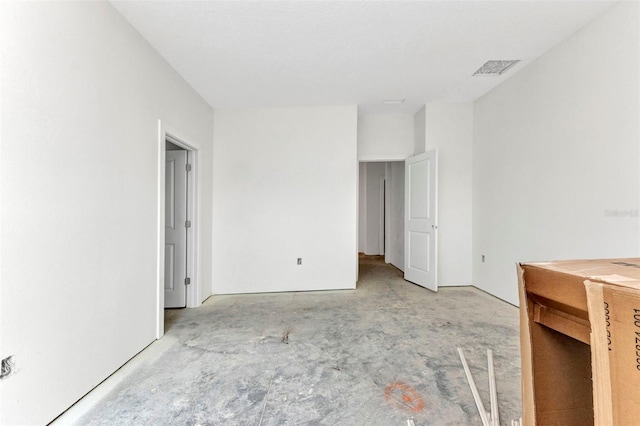 unfurnished bedroom featuring visible vents