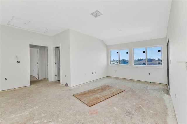 empty room featuring attic access