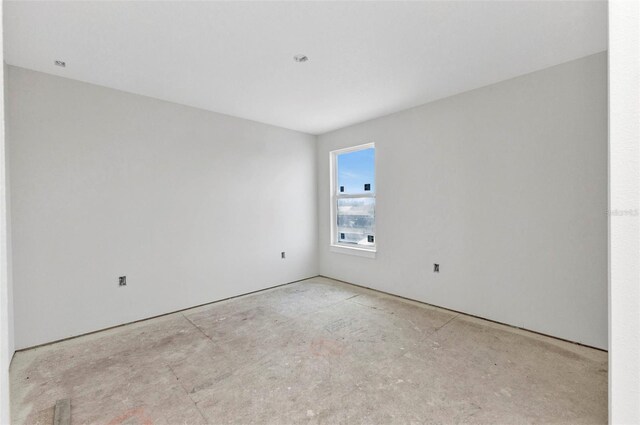 empty room featuring unfinished concrete floors