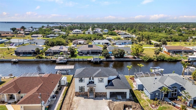 bird's eye view featuring a water view and a residential view