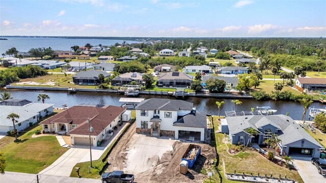 aerial view with a residential view and a water view