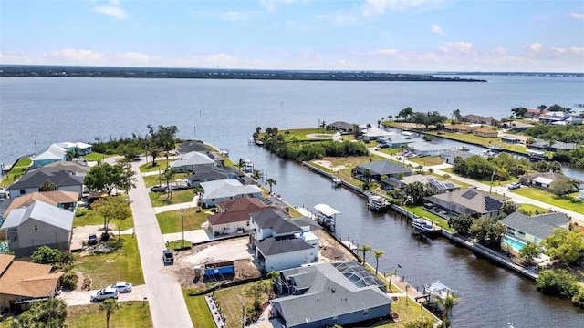 aerial view with a water view and a residential view