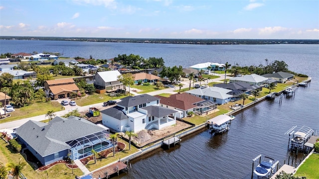 aerial view with a residential view and a water view