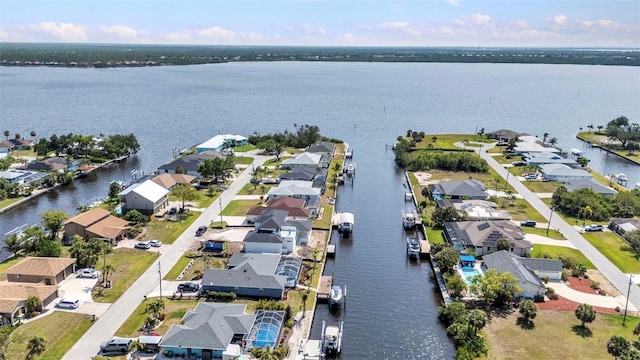 aerial view with a residential view and a water view
