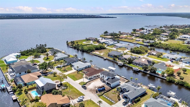 bird's eye view featuring a residential view and a water view