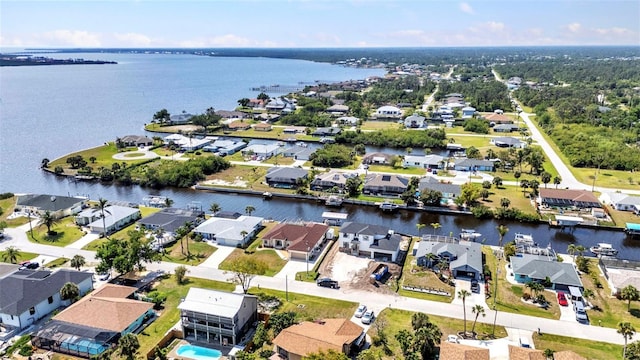 aerial view featuring a water view and a residential view