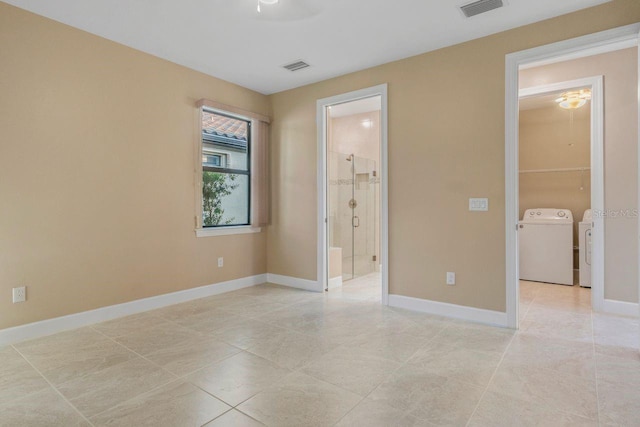 1352 Raspberry Dr, North Port, FL 34289 - unfurnished bedroom with separate washer and dryer, light tile patterned floors, ensuite bath, and a ceiling fan