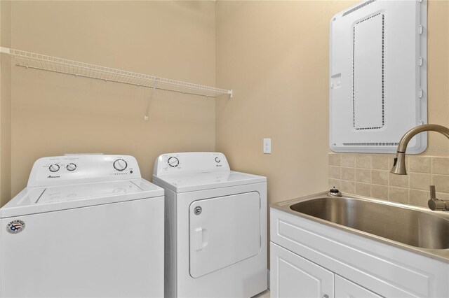 1352 Raspberry Dr, North Port, FL 34289 - washroom featuring washer and clothes dryer and cabinet space