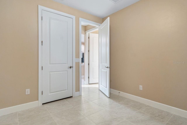 1352 Raspberry Dr, North Port, FL 34289 - spare room featuring baseboards and light tile patterned floors