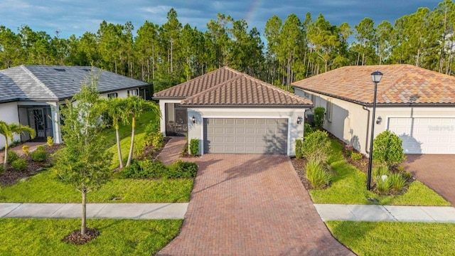 1352 Raspberry Dr, North Port, FL 34289 - view of front facade with stucco siding, a tile roof, and a front yard