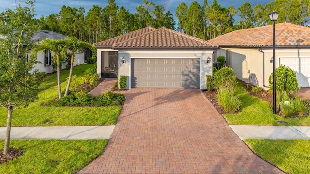 1352 Raspberry Dr, North Port, FL 34289 - mediterranean / spanish home featuring stucco siding, a front yard, a tile roof, and a garage