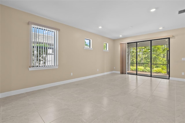 1352 Raspberry Dr, North Port, FL 34289 - empty room with recessed lighting and light tile patterned floors
