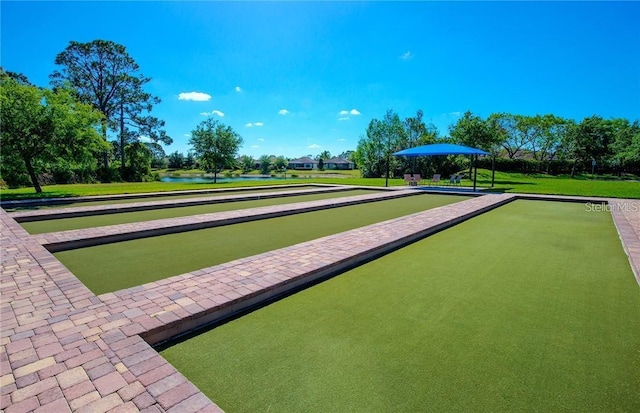 1352 Raspberry Dr, North Port, FL 34289 - surrounding community with a bocce ball area, a water view, and a yard