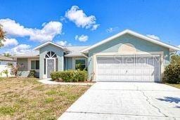 23482 Moreland Ave, Port Charlotte, FL 33954 - single story home featuring driveway and a garage