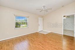 23482 Moreland Ave, Port Charlotte, FL 33954 - unfurnished room with a ceiling fan and wood finished floors