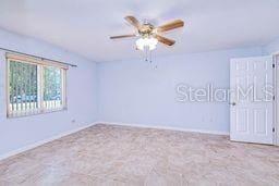23482 Moreland Ave, Port Charlotte, FL 33954 - carpeted spare room featuring ceiling fan