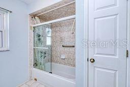 23482 Moreland Ave, Port Charlotte, FL 33954 - full bathroom with enclosed tub / shower combo