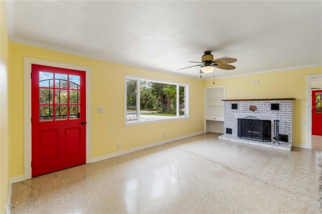 217 Palm Ave E, Nokomis, FL 34275 - unfurnished living room featuring healthy amount of natural light, baseboards, a ceiling fan, a brick fireplace, and ornamental molding