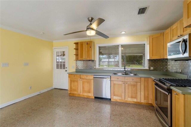 217 Palm Ave E, Nokomis, FL 34275 - kitchen featuring stainless steel appliances, a sink, baseboards, decorative backsplash, and ornamental molding