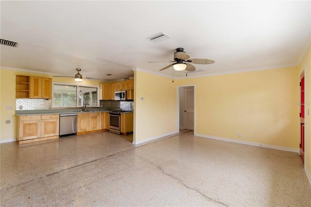 217 Palm Ave E, Nokomis, FL 34275 - kitchen featuring stainless steel appliances, a ceiling fan, a sink, baseboards, and tasteful backsplash