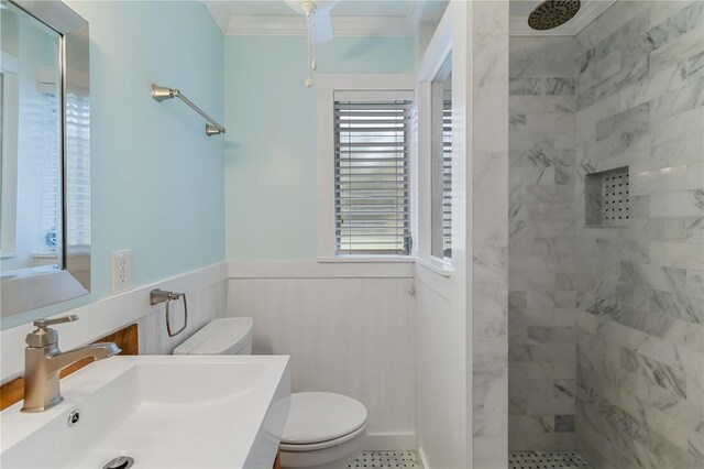 217 Palm Ave E, Nokomis, FL 34275 - bathroom featuring toilet, walk in shower, wainscoting, vanity, and crown molding