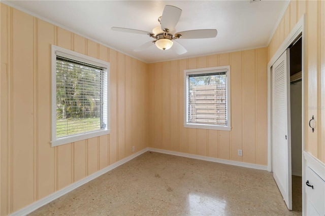 217 Palm Ave E, Nokomis, FL 34275 - unfurnished bedroom featuring baseboards, a closet, ornamental molding, and ceiling fan