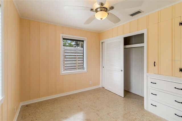 217 Palm Ave E, Nokomis, FL 34275 - unfurnished bedroom featuring baseboards, a closet, crown molding, and ceiling fan