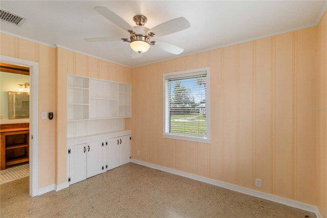 217 Palm Ave E, Nokomis, FL 34275 - empty room with crown molding, baseboards, and a ceiling fan