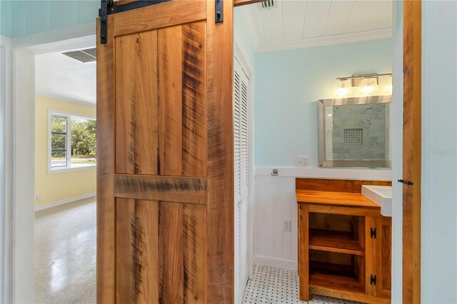 217 Palm Ave E, Nokomis, FL 34275 - bathroom featuring ornamental molding, vanity, and baseboards