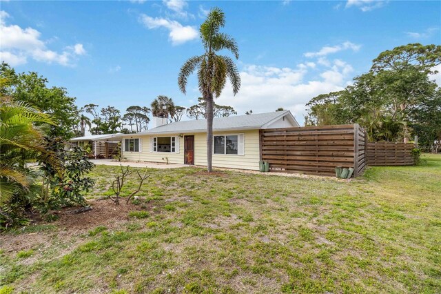217 Palm Ave E, Nokomis, FL 34275 - back of property featuring a patio area