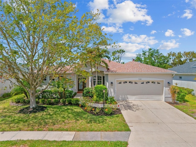 single story home with a shingled roof, a garage, concrete driveway, stucco siding, and a front lawn