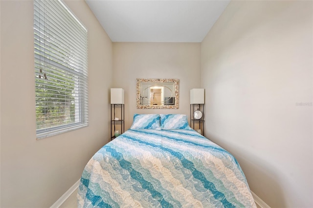 bedroom featuring baseboards