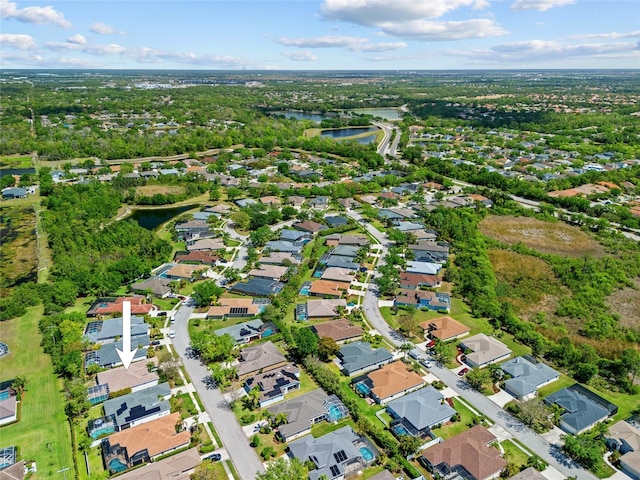 aerial view with a water view and a residential view