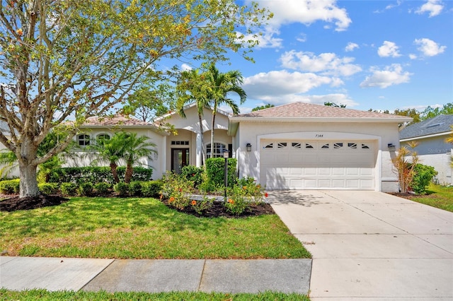 ranch-style home with a front lawn, a garage, driveway, and stucco siding