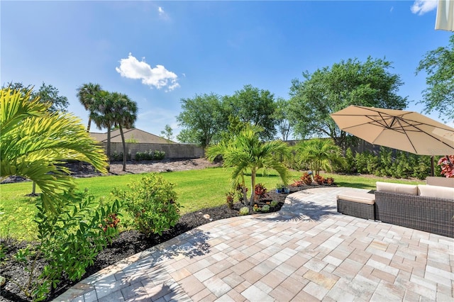 view of patio with outdoor lounge area and fence