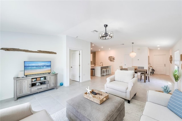 living room featuring light tile patterned floors, recessed lighting, baseboards, and visible vents