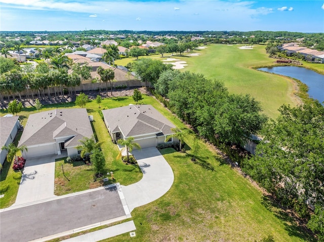 drone / aerial view featuring a water view and a residential view