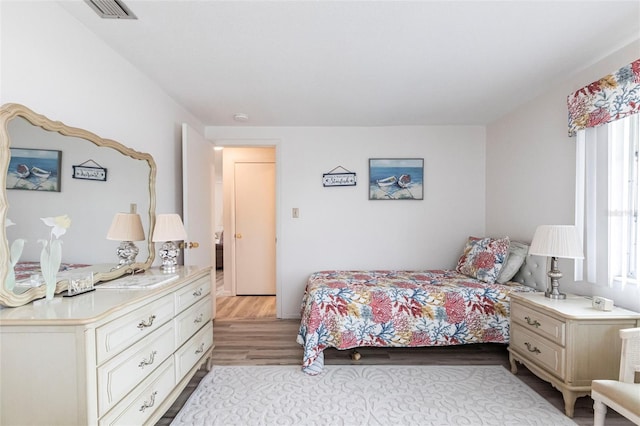 3249 Sunrise Trl, Port Charlotte, FL 33952 - bedroom with light wood finished floors and visible vents