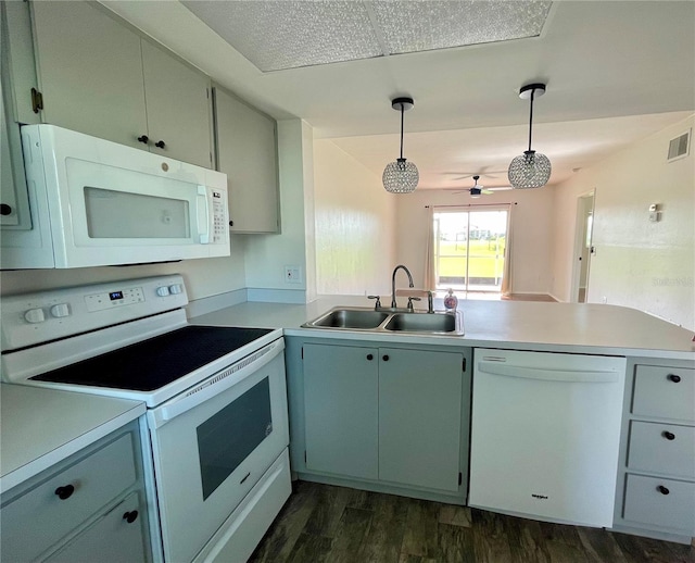 3310 Loveland Blvd Unit 1102, Punta Gorda, FL 33980 - kitchen featuring white appliances, a peninsula, ceiling fan, light countertops, and dark wood-style flooring