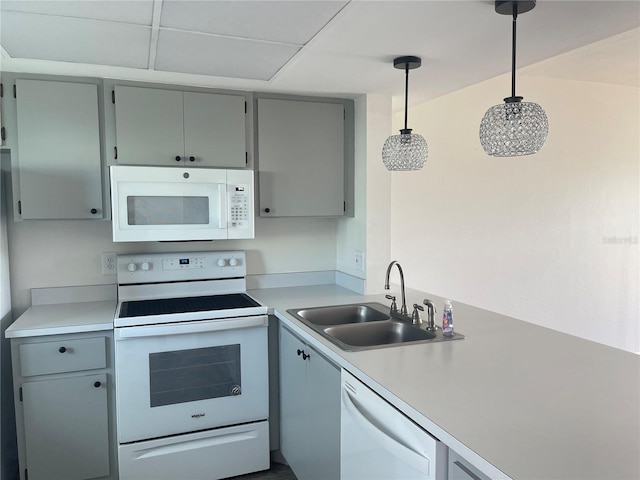 3310 Loveland Blvd Unit 1102, Punta Gorda, FL 33980 - kitchen featuring white appliances, light countertops, gray cabinets, and pendant lighting