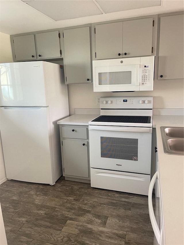 3310 Loveland Blvd Unit 1102, Punta Gorda, FL 33980 - kitchen featuring white appliances, gray cabinets, and light countertops