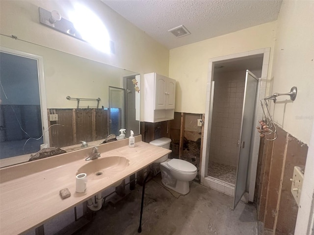 134 Peace Island Dr, Punta Gorda, FL 33950 - full bathroom with toilet, a shower stall, a textured ceiling, a sink, and visible vents