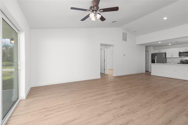 2300 Nordendale Blvd, North Port, FL 34288 - unfurnished living room featuring ceiling fan, light wood finished floors, baseboards, recessed lighting, and high vaulted ceiling